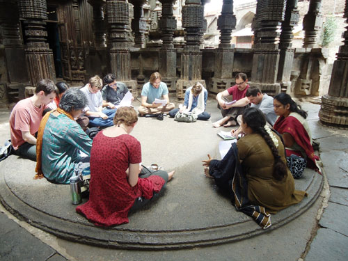 Sanskrit students reading an inscription