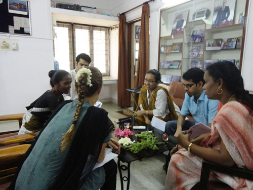 Tamil participants interacting with a monolingual guest