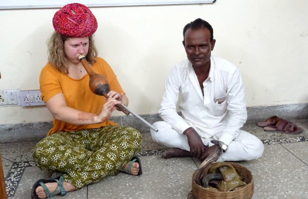 Student showing her skill during snake charmer class